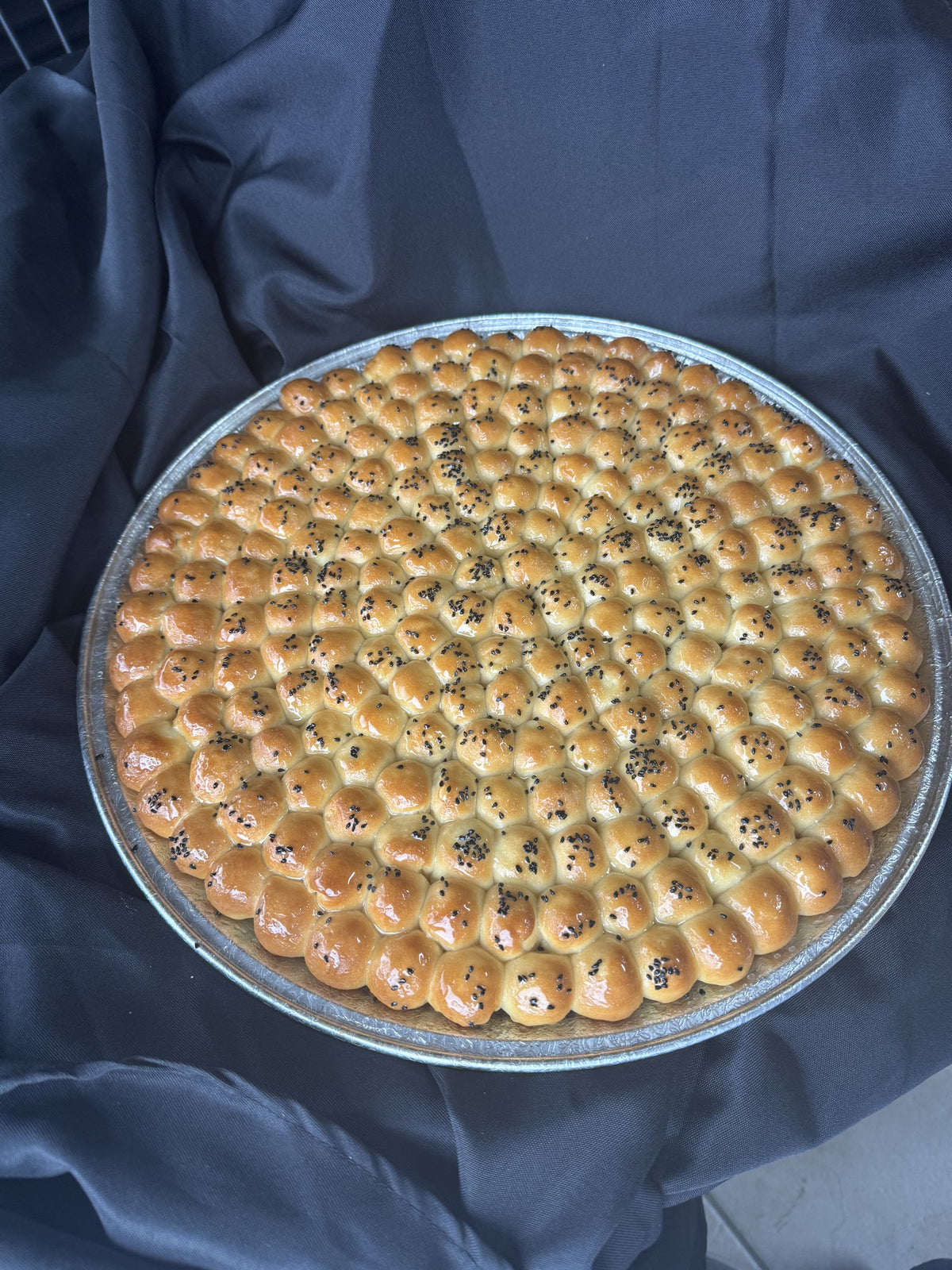 Golden Sabaya honeycomb bread, whole 16 inch tray, overhead view
