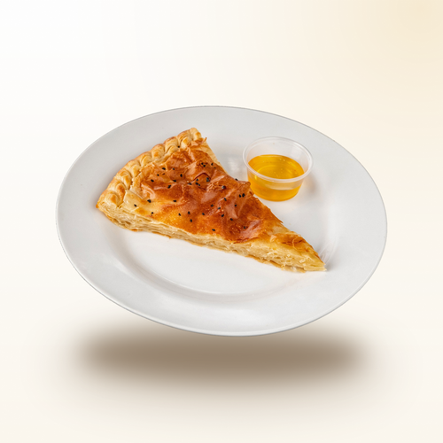 Golden Sabaya sabaya slice with honey on a plate