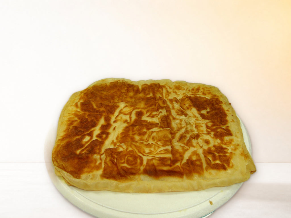 Cooked Golden Sabaya tawa bread on a plate
