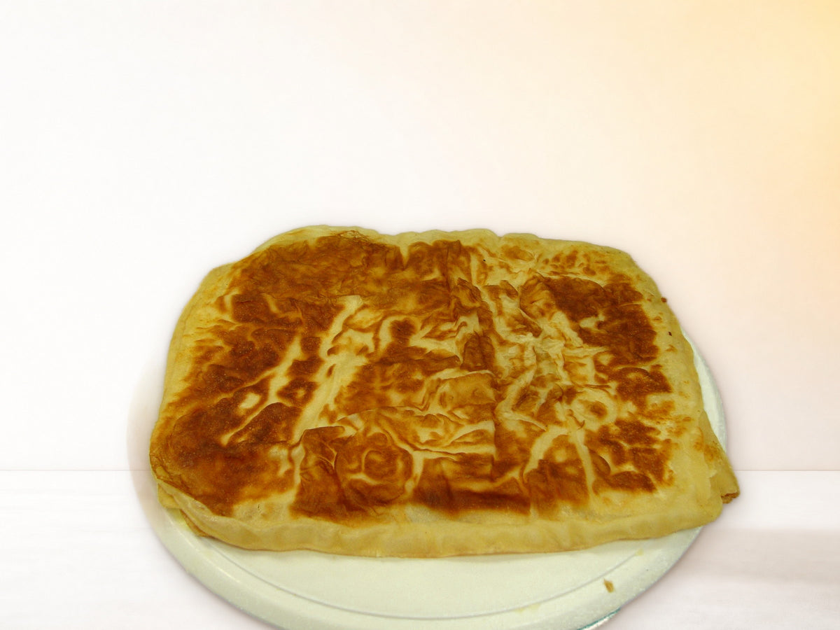 Cooked Golden Sabaya tawa bread on a plate